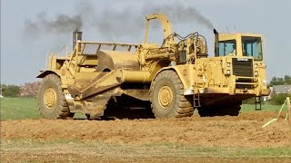 Large Caterpillar Earth Movers and Water Truck Working [upl. by Elgar]