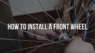 How to Install a Front Bicycle Wheel Townie [upl. by Eerehc323]